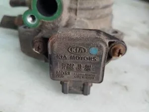 Дросельна заслінка 0K24718911 Kia Sephia II 1.8